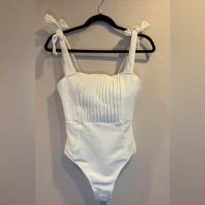 Trendy boutique White Textured One-Piece Swimsuit with Tie Straps